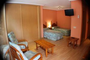 Postel nebo postele na pokoji v ubytování Hotel Las Nieves