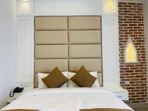 Postel nebo postele na pokoji v ubytování Hotel Matina Suites