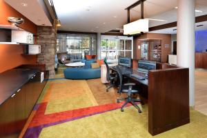 an office with a desk with a computer on it at Fairfield Inn & Suites by Marriott Raleigh Capital Blvd./I-540 in Raleigh
