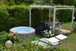 a backyard with a pool and a gazebo at Villa Luisa Design in Colle di Val d'Elsa