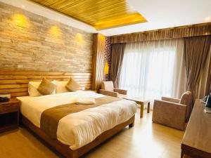 Postel nebo postele na pokoji v ubytování Hotel Matina Suites