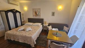 Posteľ alebo postele v izbe v ubytovaní Viktorija Apartments