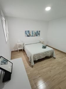 Posteľ alebo postele v izbe v ubytovaní Piso Avenida junto a la Playa + 16 fotografií