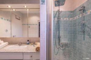 a bathroom with a shower and a sink at Maison SAUTREAU Bout du Lac in Doussard +12 photos