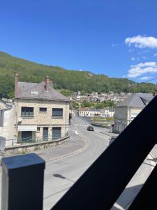 a view from a balcony of a street with a road at Les Gîtes de Monthermé L'Appartement belvédère sur Monthermé in Monthermé