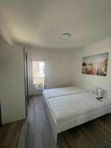 Postel nebo postele na pokoji v ubytování Apartmani Vision Mandre
