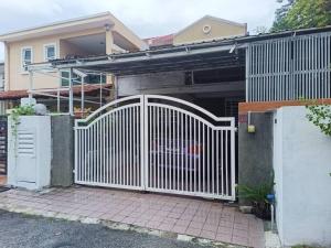 a white gate in front of a house at Hill Top 2StoreyHouse BktAntarabangsa,Free Unlimited Parking in Ampang