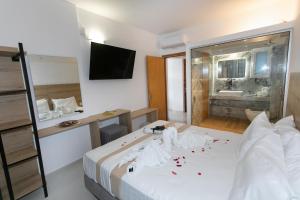 Postel nebo postele na pokoji v ubytování Hotel Philoxenia