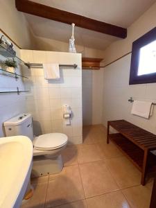 a bathroom with a toilet and a sink at Casa Clot III- Formentera in Illes Balears