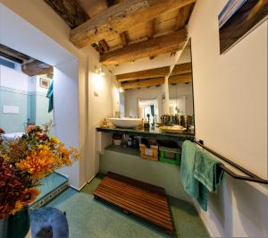 a bathroom with a sink and a counter with a mirror at Casagiuliana in Perugia