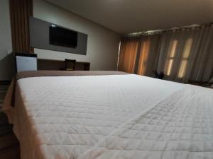 Postel nebo postele na pokoji v ubytování Hotel Reserva do Xingó