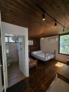 a bedroom with a bed and a bathroom in a room at SEA bed and restaurant 2 in Borsh