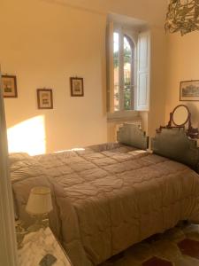 a bedroom with a large bed with a window at Villa Giada in Trani +38 photos