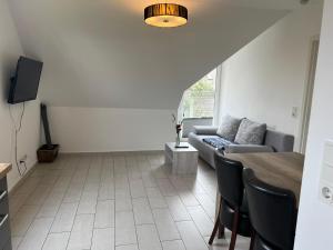 Televiisor ja/või meelelahutuskeskus majutusasutuses Strandhaus Rose Apartement 31