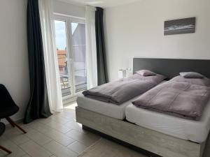 Voodi või voodid majutusasutuse Strandhaus Rose Apartement 31 toas