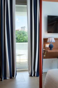TV a/nebo společenská místnost v ubytování Murè Hotel Numana