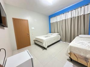 Postel nebo postele na pokoji v ubytování Perola dos lençóis