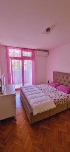 Postel nebo postele na pokoji v ubytování Apartman Lila