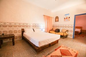Una cama o camas en una habitación de Riad Isla