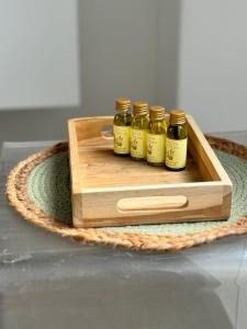 a wooden crate with four bottles of honey in it at Guest House Gent in Ghent