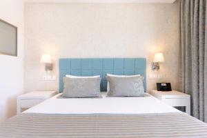 Postel nebo postele na pokoji v ubytování Melina Bay Boutique Hotel