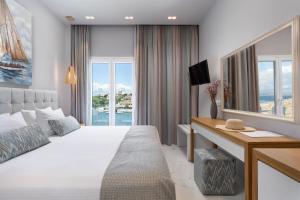 Postel nebo postele na pokoji v ubytování Melina Bay Boutique Hotel