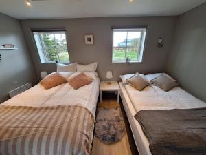 Postel nebo postele na pokoji v ubytování Hallfreðarstaðir 1 Apartments