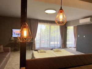 Postel nebo postele na pokoji v ubytování Clepsydra Residence