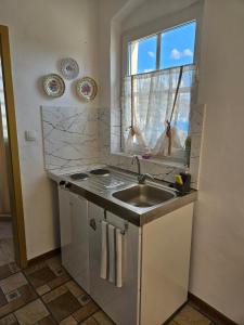 Kuchyň nebo kuchyňský kout v ubytování Apartmany Detvanka + 22 fotografií