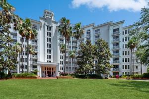 a large apartment building with a lawn in front of it at Elation #5216 in Destin