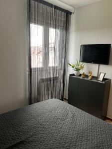 Postel nebo postele na pokoji v ubytování Apartman Tina