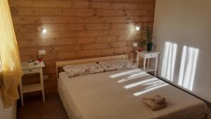 Postel nebo postele na pokoji v ubytování b&b Onda Verde