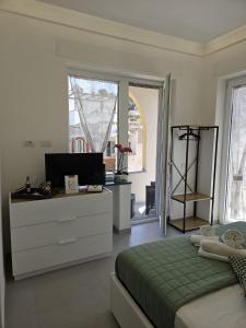 Postel nebo postele na pokoji v ubytování Il Portico B&B Capri