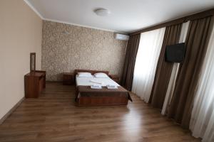 Hotel LaMa 2 tesisinde bir odada yatak veya yataklar