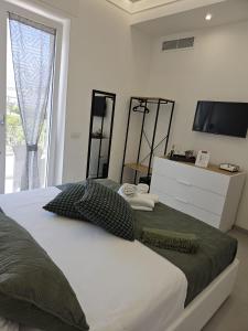 Postel nebo postele na pokoji v ubytování Il Portico B&B Capri