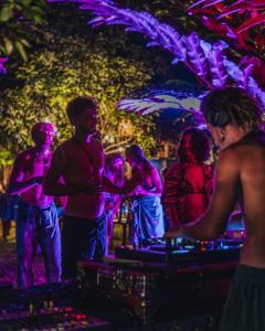 a group of people standing around at a party at Madoldu Eco Resort in Ahangama