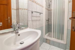 a bathroom with a sink and a shower at Villa Nikola in Neum +55 photos