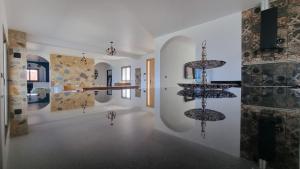 a room with some sculptures on the walls of a building at Villa avec piscine Asilah, terrain de foot privative in Asilah
