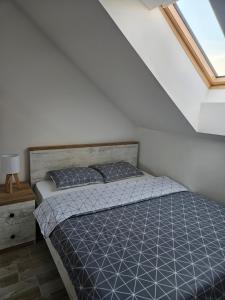 Postel nebo postele na pokoji v ubytování Apartman Sky