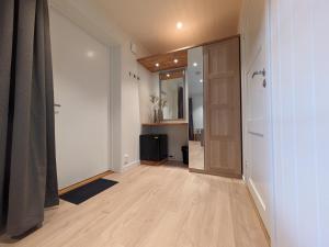 an empty room with a hallway with a door at Villa Fregn in Ljørdalen +278 photos