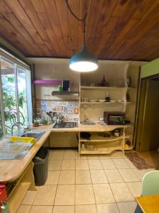 a kitchen with a sink and a counter top at Departamento La Solar in Frutillar