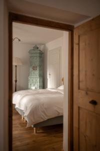 A bed or beds in a room at Ottmanngut Suite and Breakfast