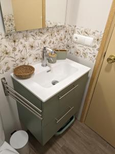 a bathroom with a sink and a toilet at La Muralla in Villajoyosa