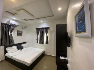 Postel nebo postele na pokoji v ubytování Hope Residence Hotel and Suites