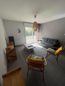 Posedenie v ubytovaní Les Buissonnets - Mer & Campagne - Maison de vacances - 2 chambres - 1 salon - 1 salle de bains - 1 cuisine - 72 m2