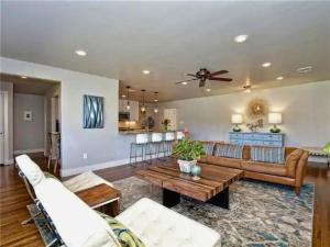 a living room with a couch and a table at Private Pool & Hot Tub! Charming Hill Country Home Minutes to Wineries/Shops! in Johnson City