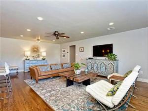 a living room with a couch and a table at Private Pool & Hot Tub! Charming Hill Country Home Minutes to Wineries/Shops! in Johnson City