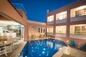 a swimming pool in the middle of a building at Omiros Boutique Hotel (Adults Only) in Rethymno Town