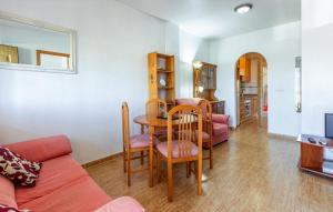 a living room with a table and chairs at 2 Bedroom Beautiful Home In Castalla in Castalla