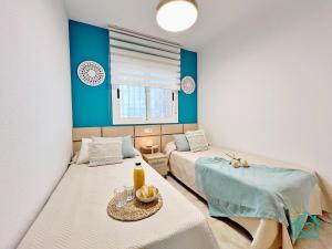 a room with two beds and a table and a couch at Retiro Zen en Tu Rincón Mediterráneo in Oropesa del Mar +62 photos